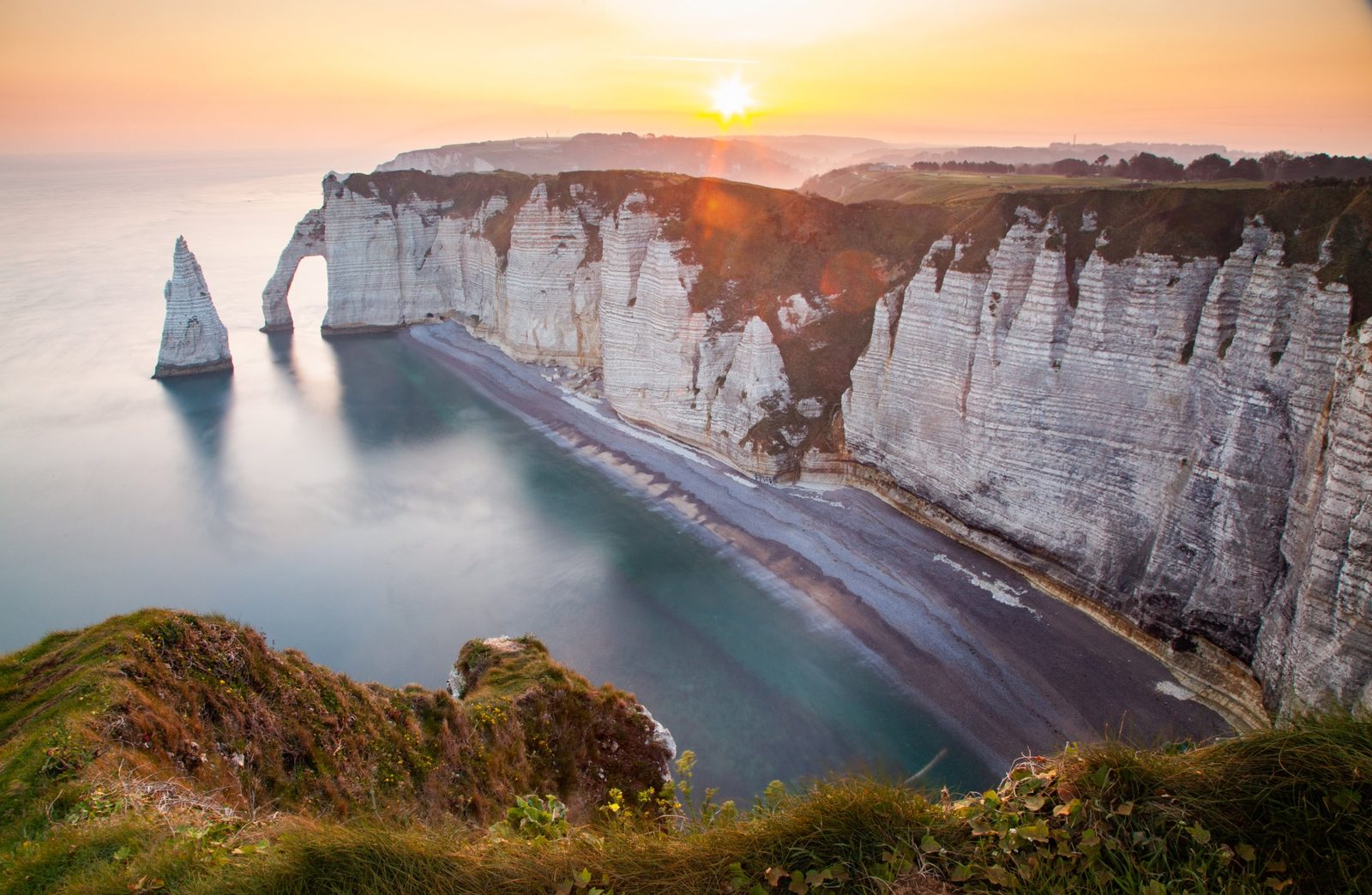 White cliffs of Etretat above the sea in the evening light