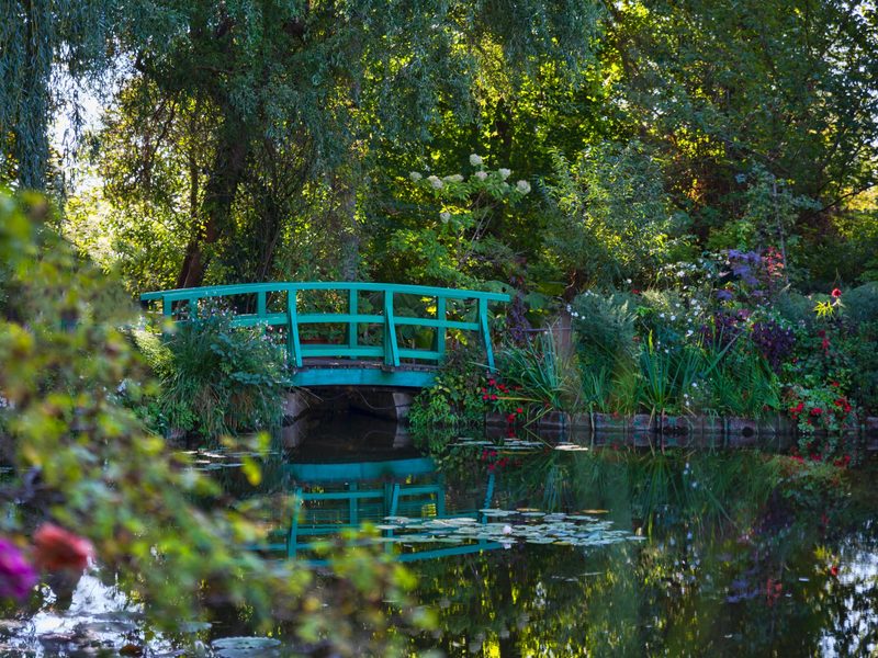 The green Japanese bridge over the water lily pond in Giverny