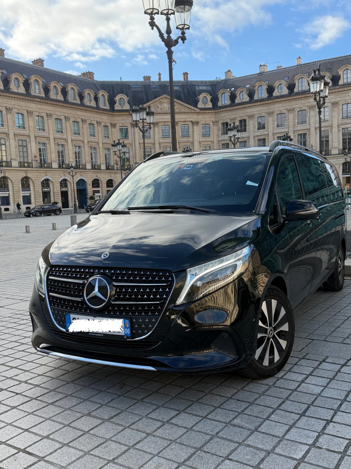 Black Mercedes V-Class parked on Place Vendôme in Paris
